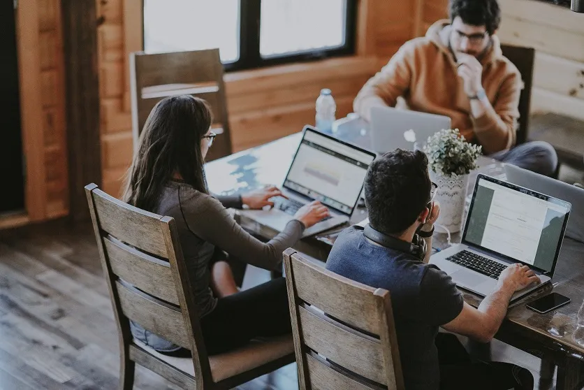 Developers collaborating on outsourced app and web development